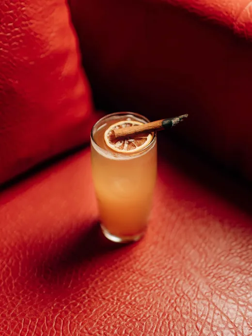 A cocktail on red leather
